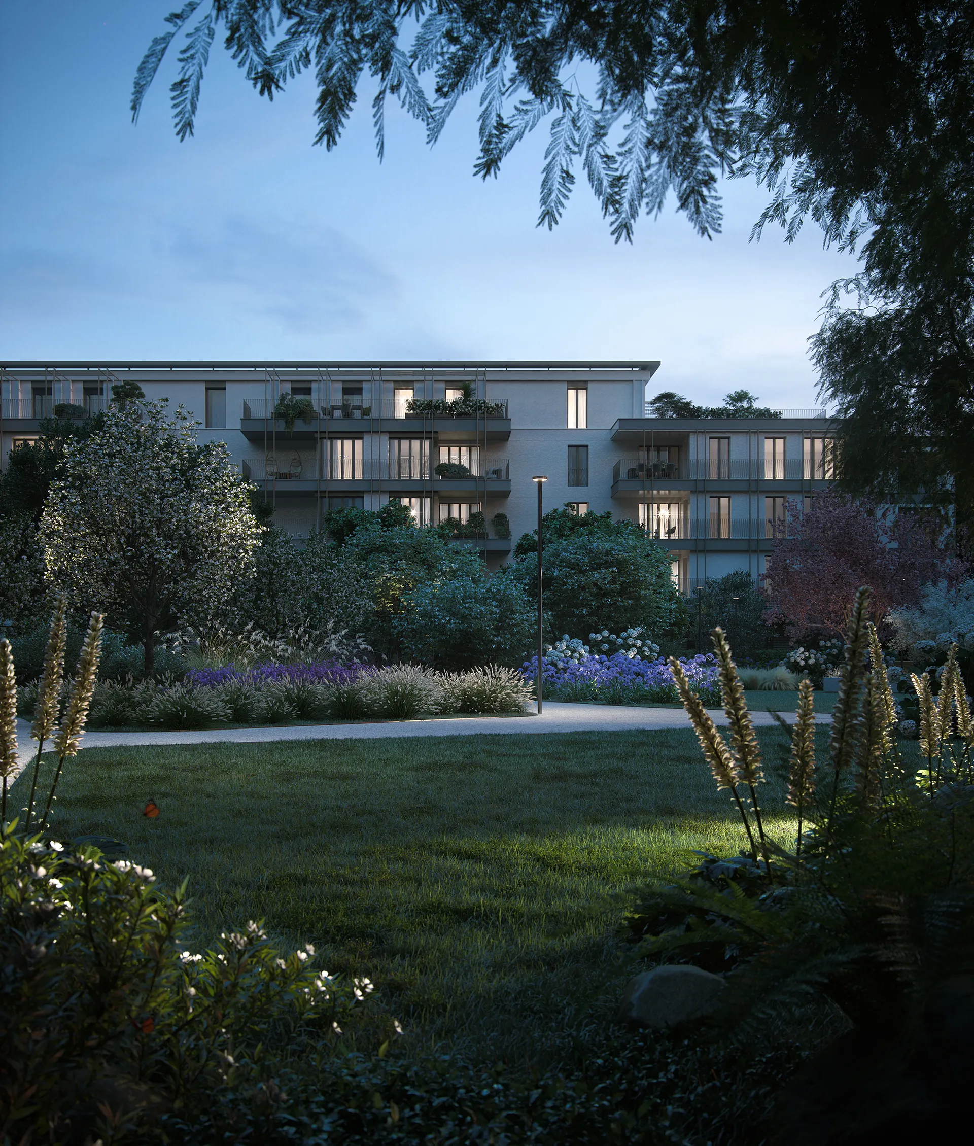 Facciata Veridia Living immersa nel paesaggio verde privato al crepuscolo