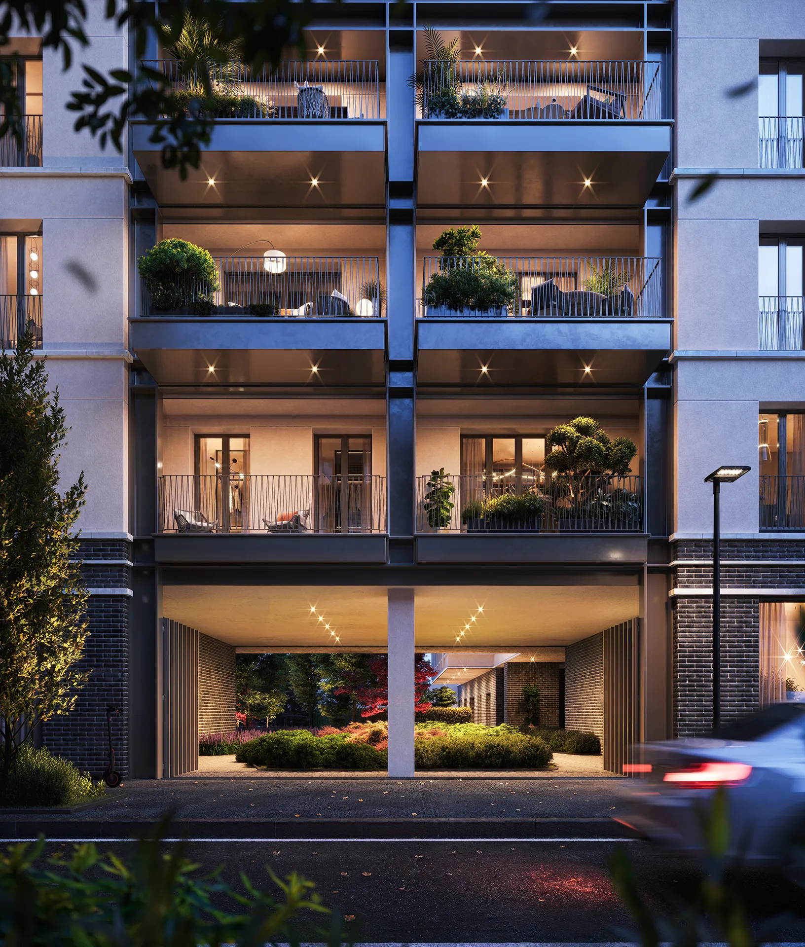 Vista notturna delle logge private con arredi moderni, verde e luci suggestive